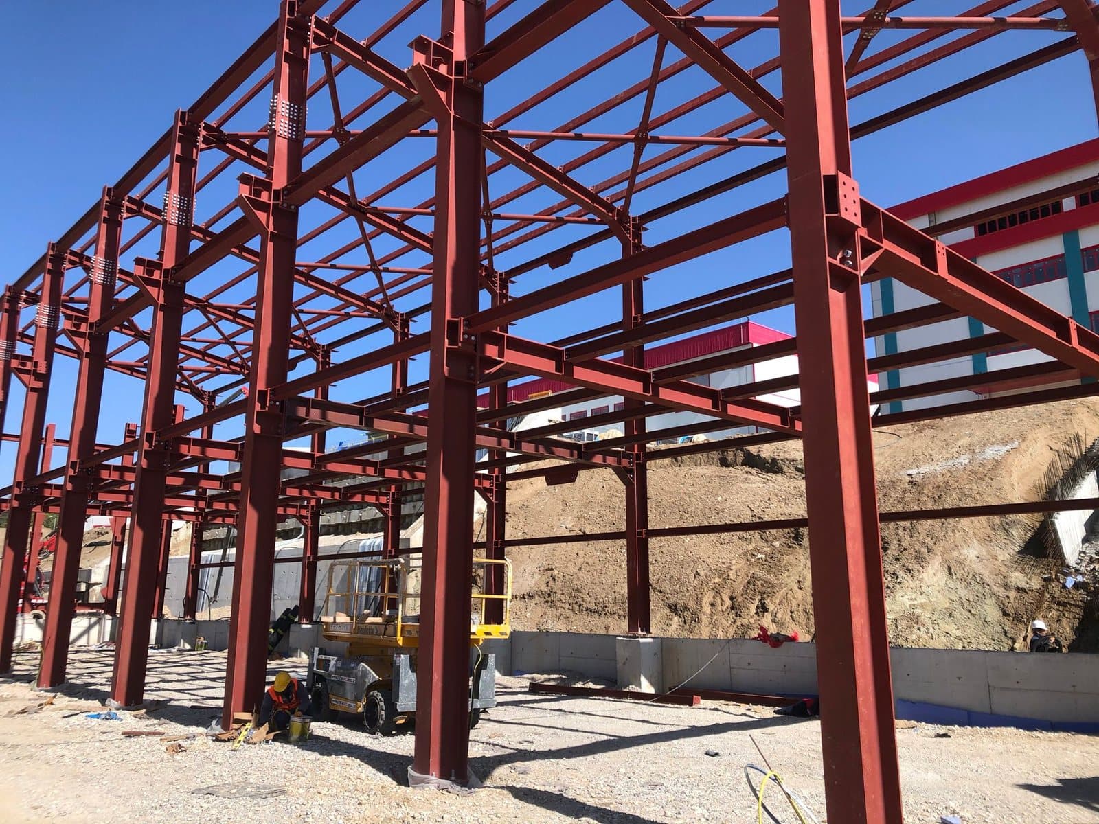 Close-up of maroon steel column and beam connections