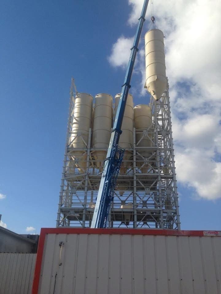 Silos being lifted into the steel support tower