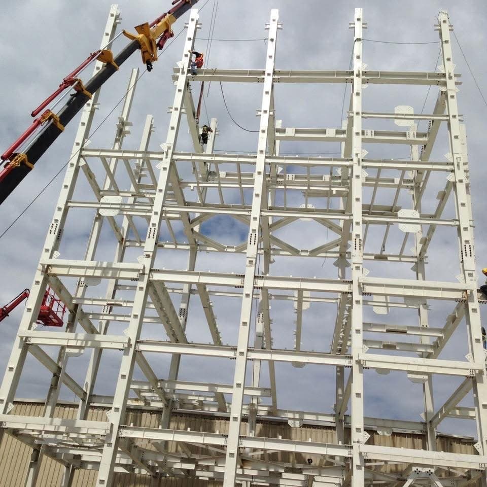 Steel tower frame under crane erection, close-up