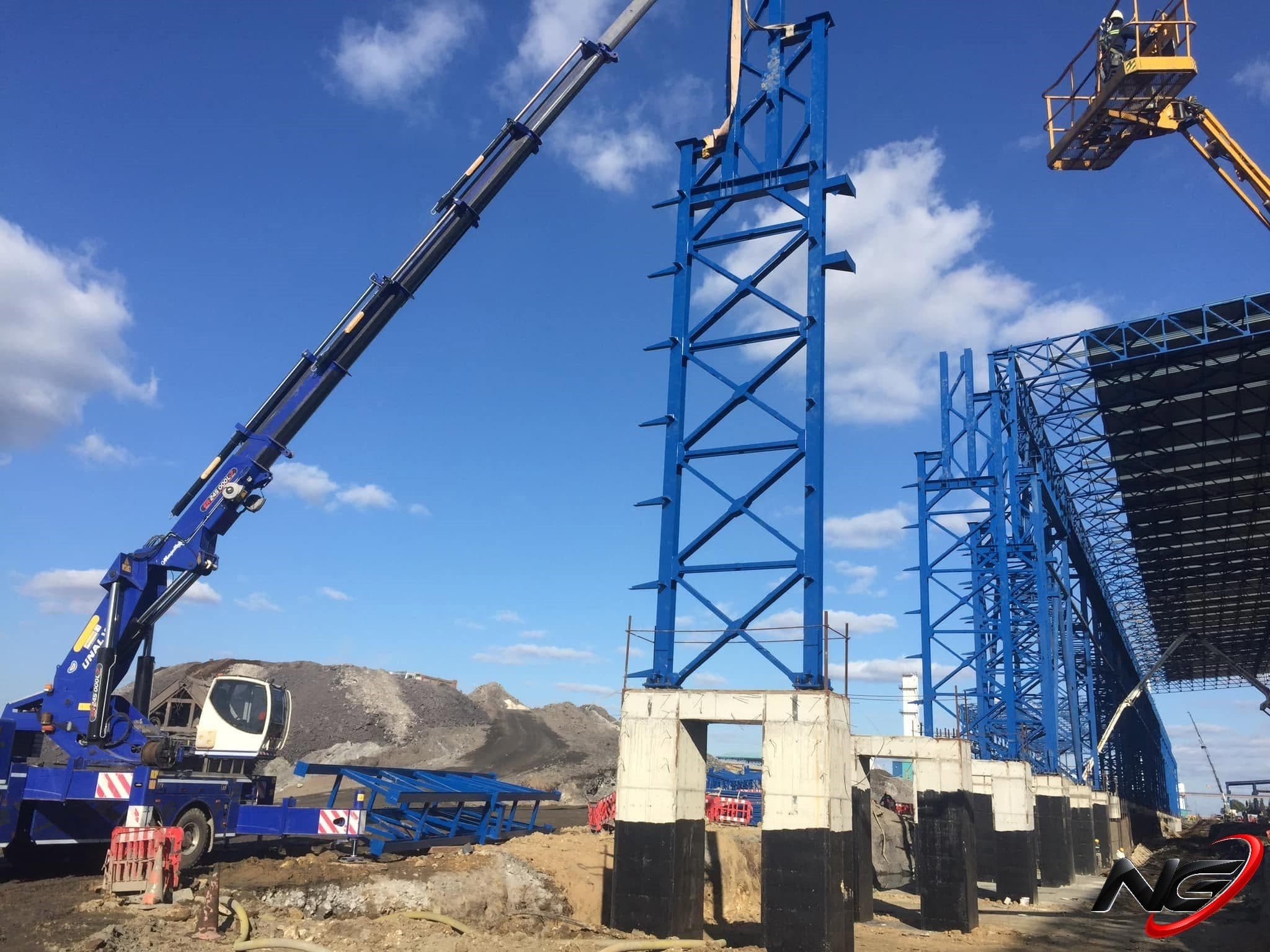 Steel columns being erected by crane at the Kaptan Demir Çelik plant