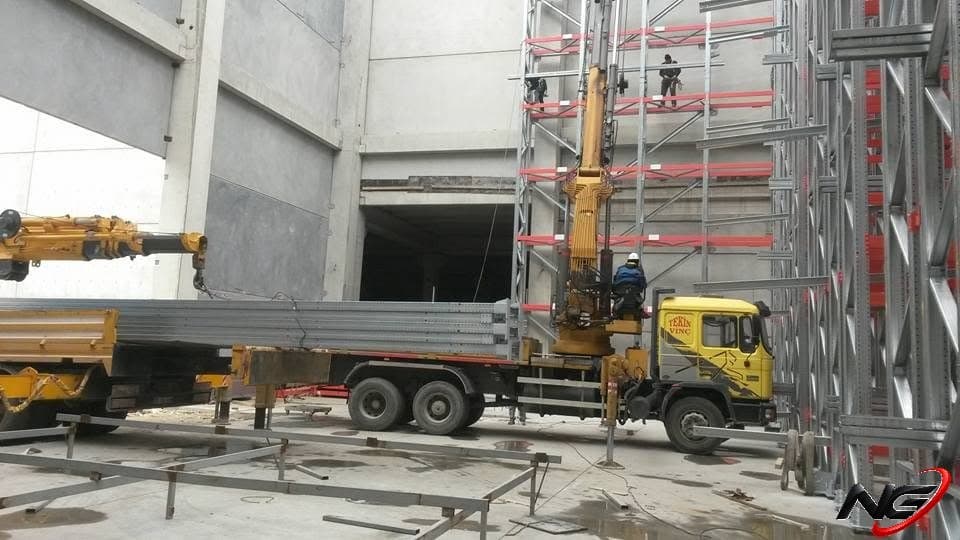 Racking members being unloaded with a crane truck